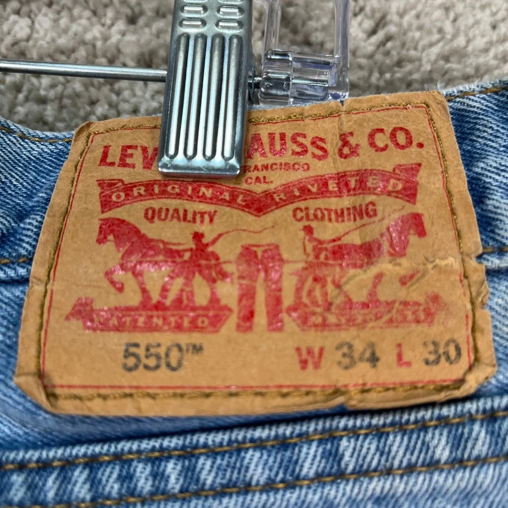 Levis 550 Jeans Mens 34x30 Light Wash Blue Straight Leg 5 Pocket Distressed FLAW